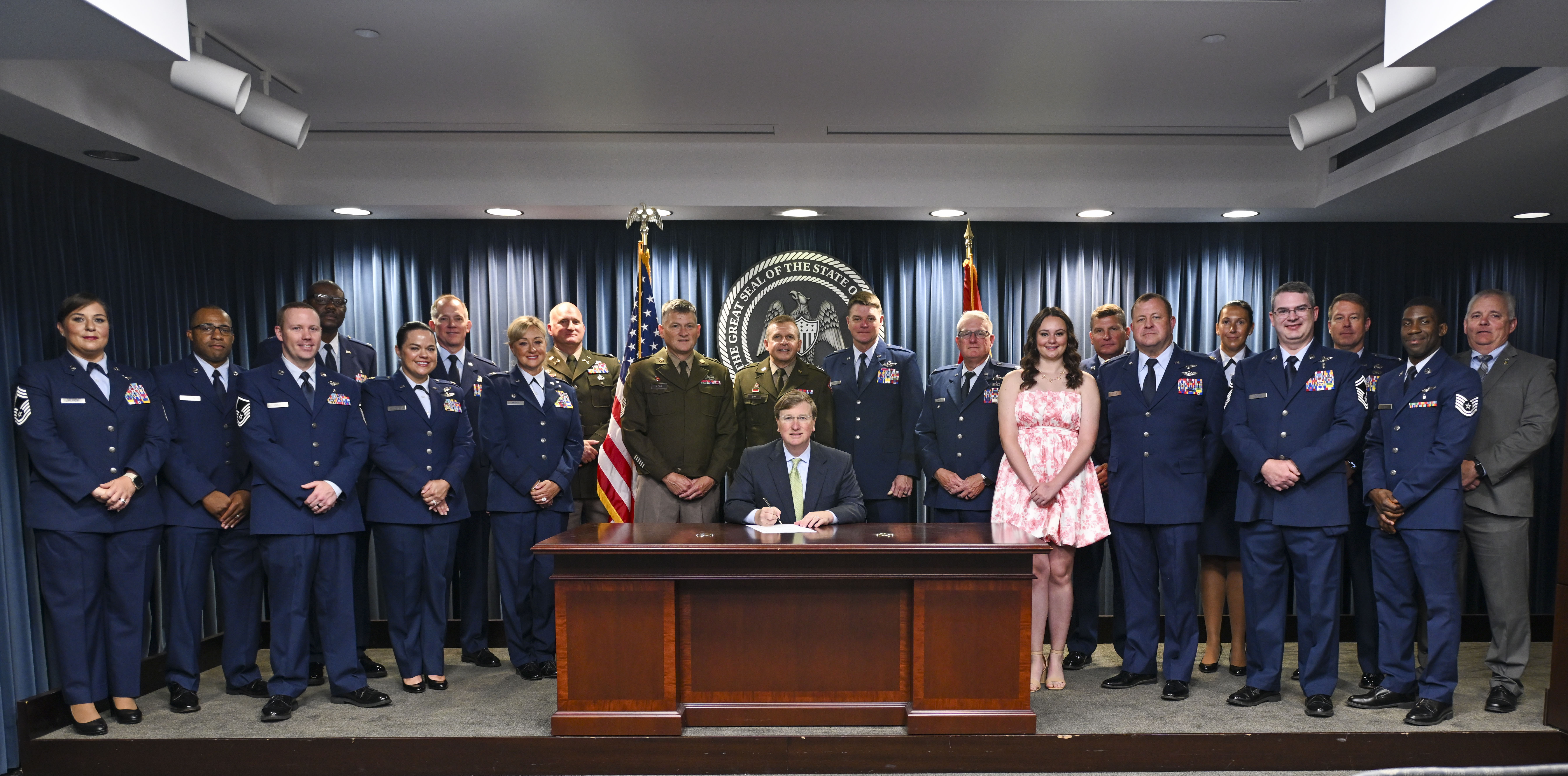 Gov. Tate Reeves signs House Bill 1262 into law alongside service members from the Mississippi Army and Air National Guard, June 25, 2025, in Jackson, Mississippi. The bill authorizes licensed practical nursing applicants who are U.S. Army combat medics, U.S. Navy hospital corpsmen, or U.S. Air Force aerospace medical service specialists to obtain licensure to practice practical nursing in the state. (U.S. Air National Guard photo by Capt. Kiara Spann)