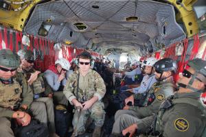 Members of the Mississippi Army National Guard's 185th Expeditionary Combat Aviation Brigade transport search and rescue team members to the hardest hit areas in Tampa following Hurricane Helene, Sept. 27, 2024.