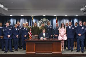 Gov. Tate Reeves signs House Bill 1262 into law alongside service members from the Mississippi Army and Air National Guard, June 25, 2025, in Jackson, Mississippi. The bill authorizes licensed practical nursing applicants who are U.S. Army combat medics, U.S. Navy hospital corpsmen, or U.S. Air Force aerospace medical service specialists to obtain licensure to practice practical nursing in the state. (U.S. Air National Guard photo by Capt. Kiara Spann)